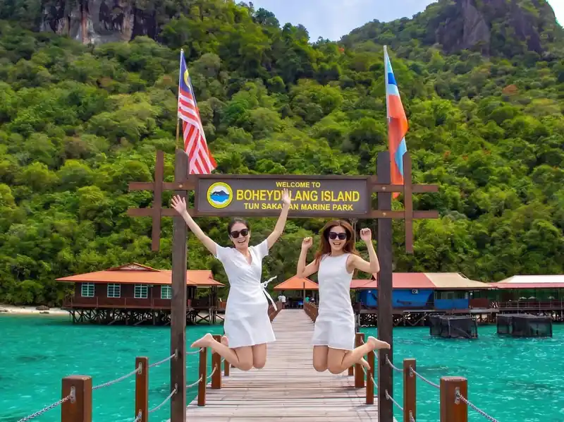 Hiking Bohey Dulang for panoramic lagoon views with Sisipan Island Resort in the Semporna archipelago