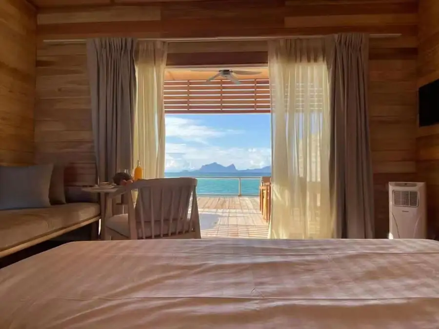 King bed with pink decor Sisipan Island Resort
