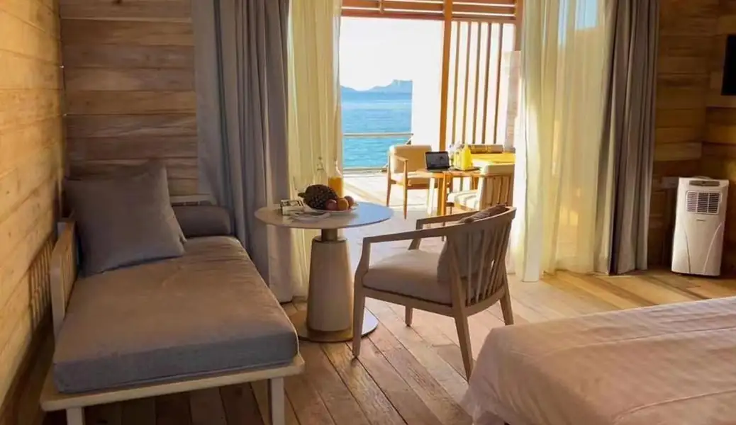 Relaxing bedroom seating area Sisipan Island Resort