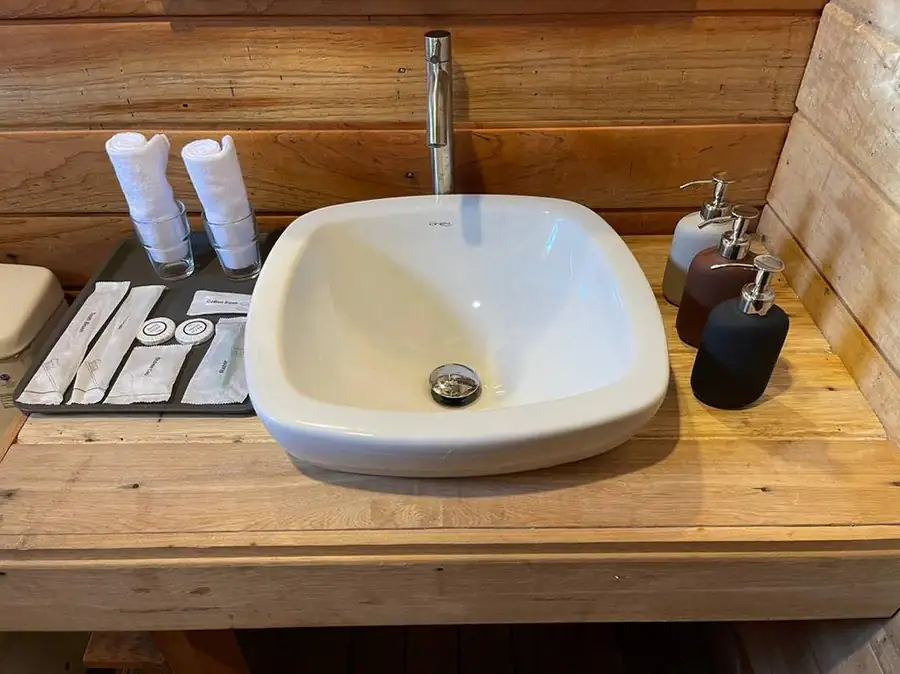 Vessel sink on wooden vanity Sisipan Island Resort